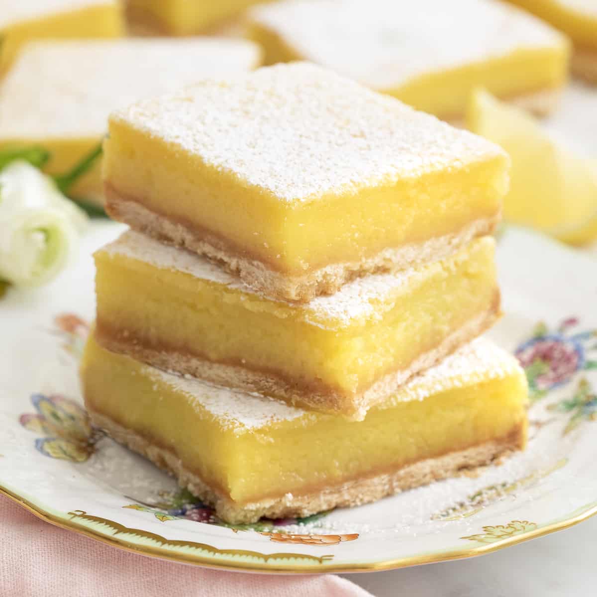 Lemon bars on a floral plate